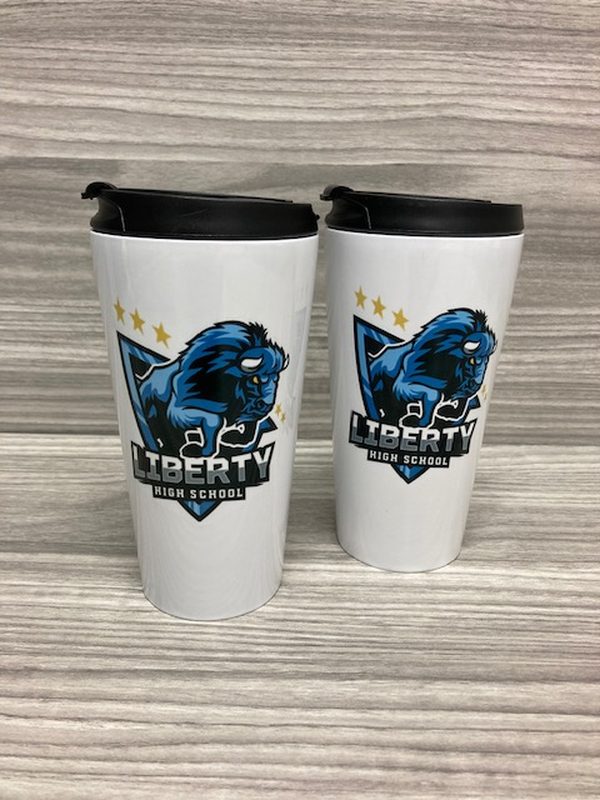 White travel tumblers printed with the Liberty High School bear mascot